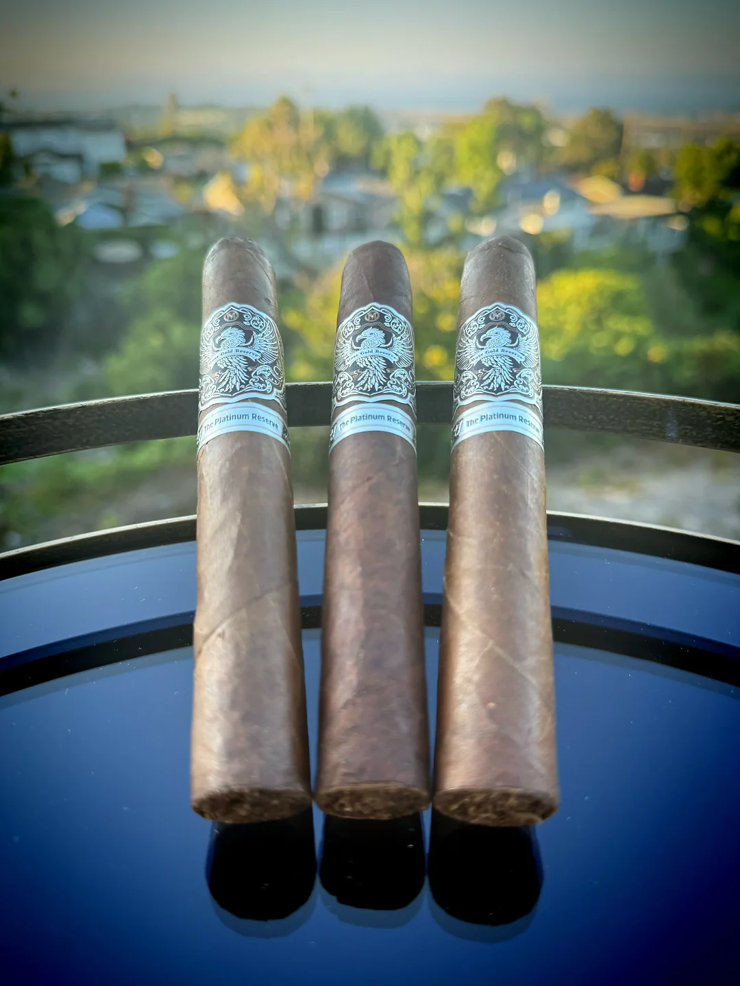 Three Platinum Reserve cigars standing upright